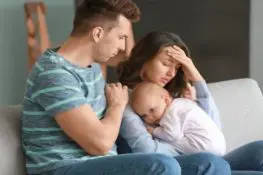 baby-and-unhappy-couple