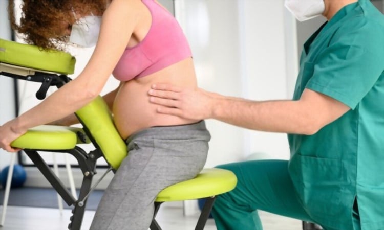 How To Safely Massage Your Back At Home During Pregnancy