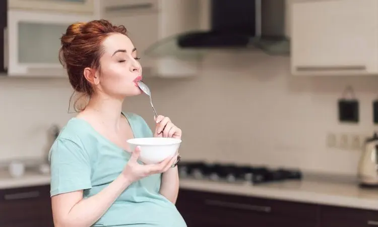 Pregnant woman eating snacks midnight